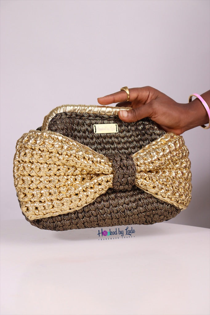 Ajike Golden bow clutch purse