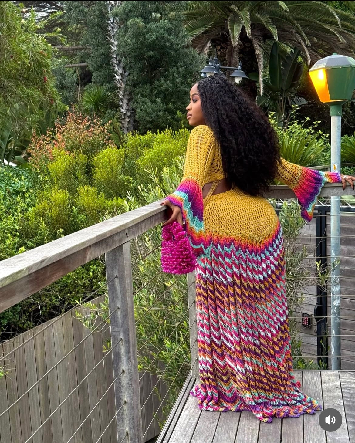 veekee james wearing hookedbylade crochet outfit in yellow and rainbow mix maxi back view