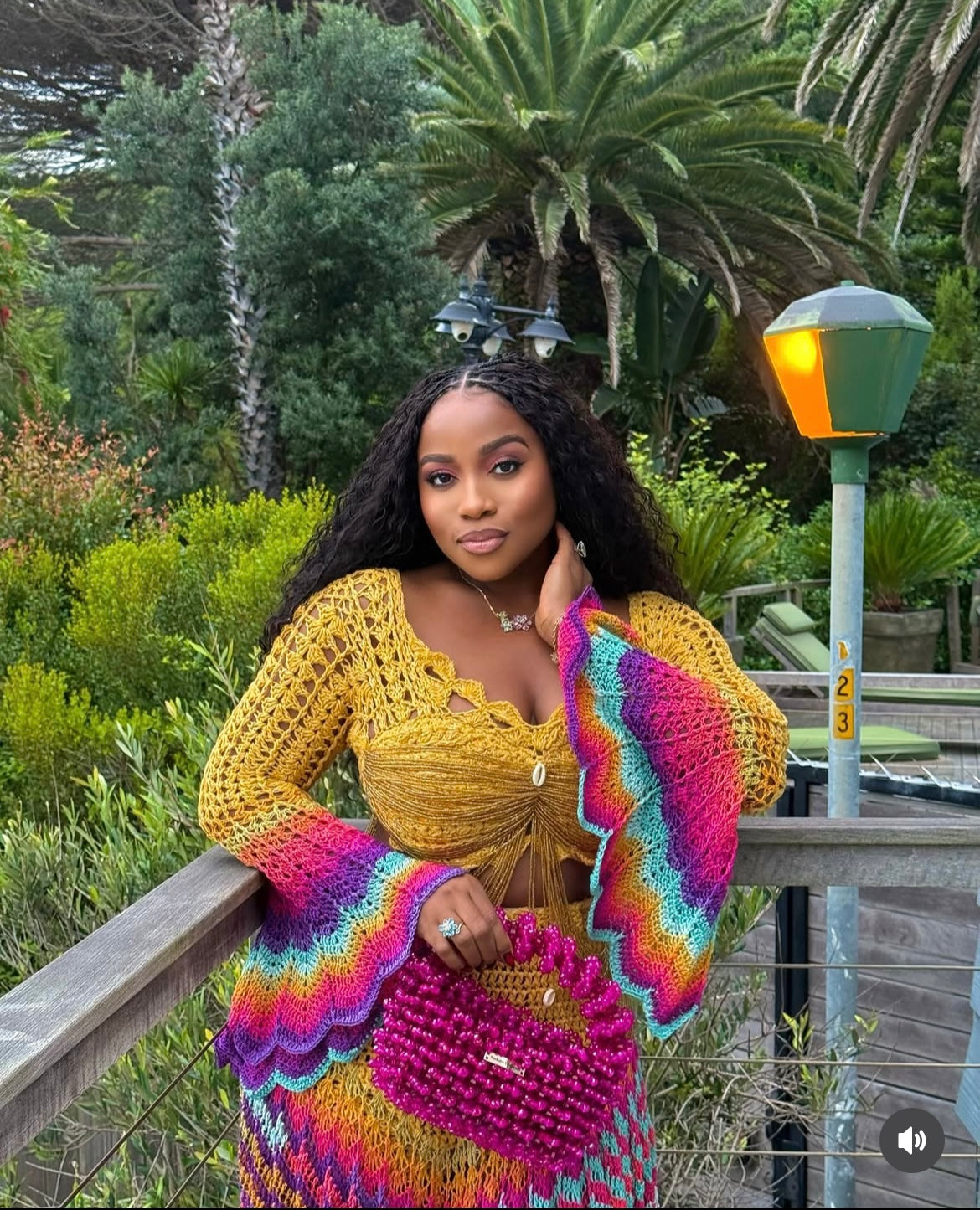 veekee james wearing hookedbylade crochet outfit in yellow and rainbow mix maxi close up view
