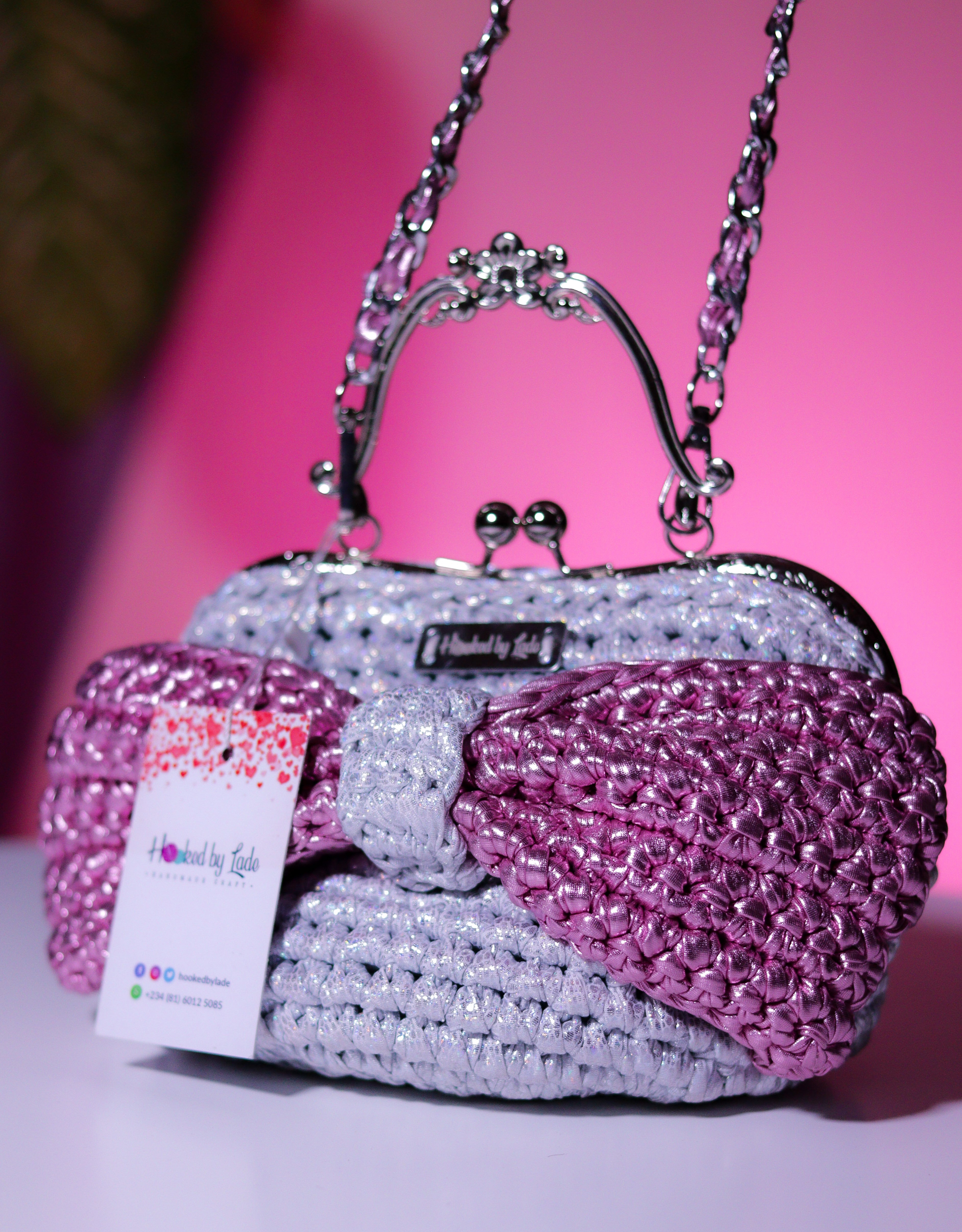 ‘Ajike’ clutch purse (with a pink bow)