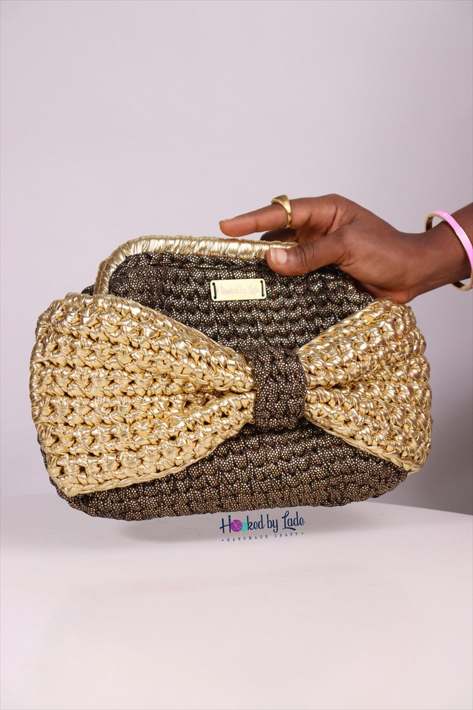 ‘Ajike’ Golden bow clutch purse