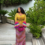 veekee james wearing hookedbylade crochet outfit in yellow and rainbow mix maxi