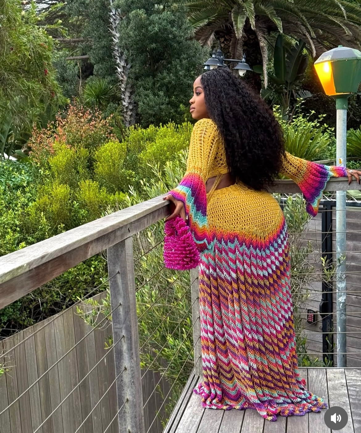 veekee james wearing hookedbylade crochet outfit in yellow and rainbow mix maxi back view
