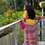 veekee james wearing hookedbylade crochet outfit in yellow and rainbow mix maxi back view